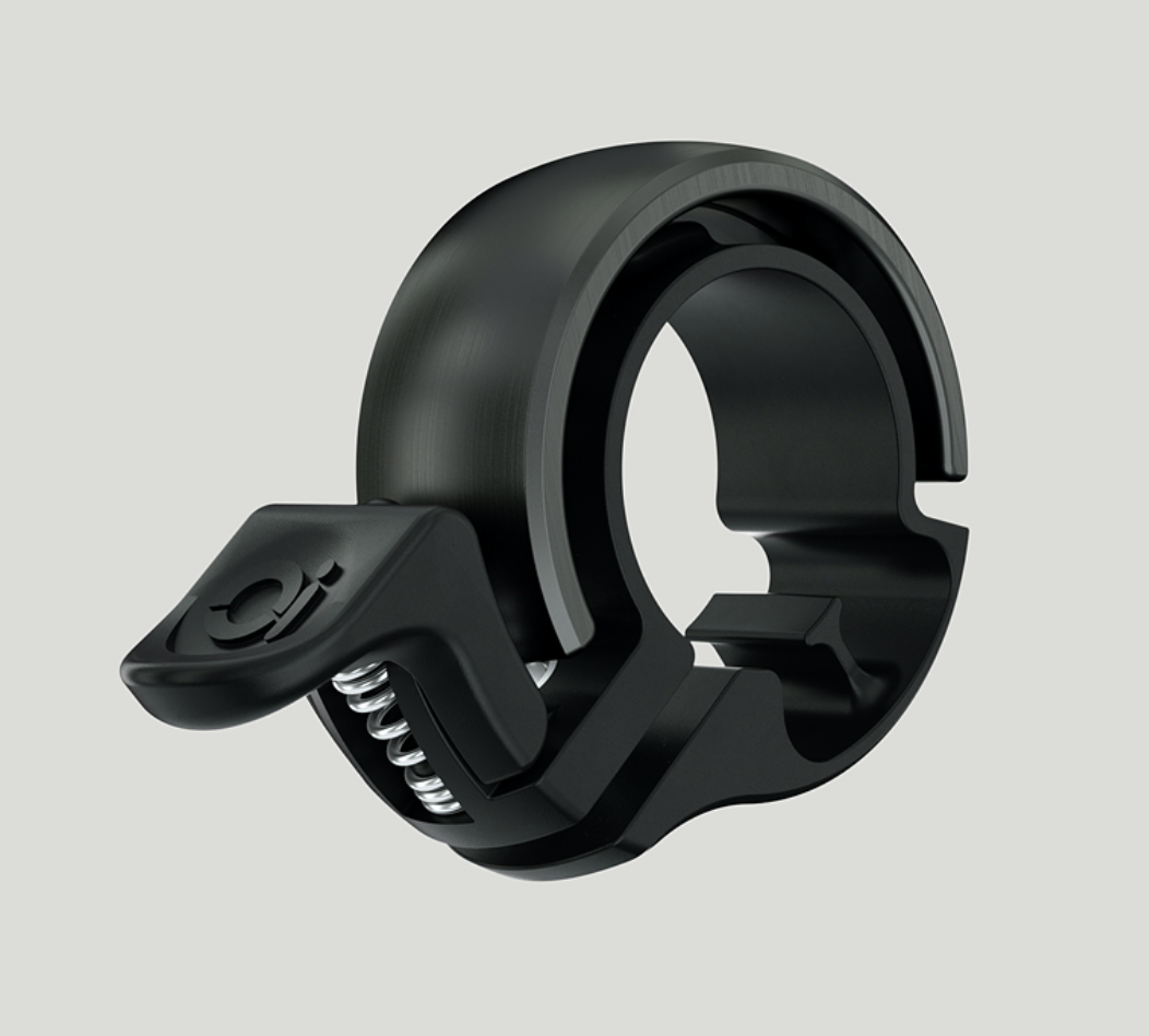 Die Knog Oi Classic ist eine rgförmige Fahrradklingel in eigenständigem, elegantem Design.