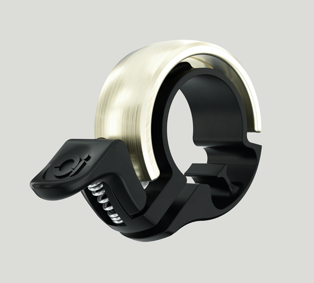 Die Knog Oi Classic ist eine rgförmige Fahrradklingel in eigenständigem, elegantem Design.