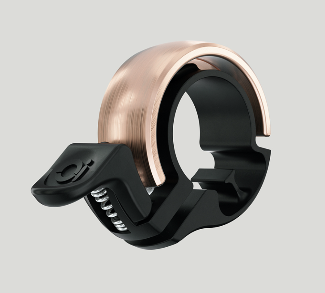 Die Knog Oi Classic ist eine rgförmige Fahrradklingel in eigenständigem, elegantem Design.